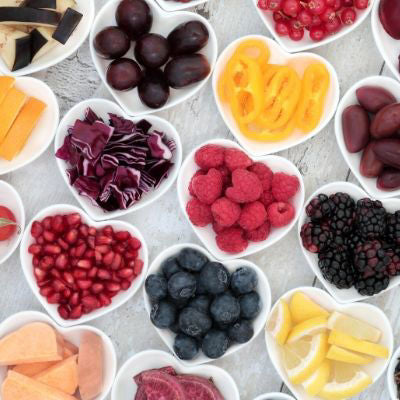 berries, fruits and vegetables on small plates