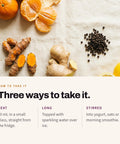 Serving suggestion: Mandarins, turmeric root, ginger root, black peppercorns and lemon on linen, with three ways to serve Shoti Turmeric Shot