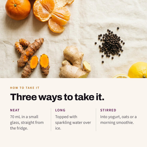 Serving suggestion: Mandarins, turmeric root, ginger root, black peppercorns and lemon on linen, with three ways to serve Shoti Turmeric Shot