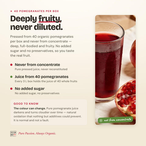 Glass of deep ruby red PassionBio pomegranate juice