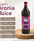 Organic Aronia Juice 700 ml glass bottle – Canada packaging, bottle on a wooden board