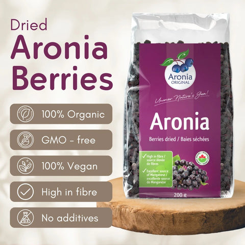 Organic Dried Aronia Berries 200 g pouch – Canada packaging, on a wooden board