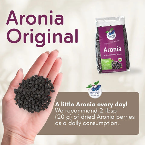 Organic Dried Aronia Berries 200 g pouch – Canada packaging, with a handful of dried berries