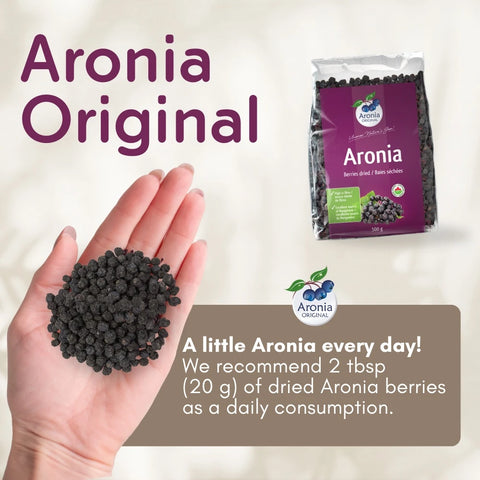 Organic Dried Aronia Berries 500 g pouch – Canada packaging, with a handful of dried berries