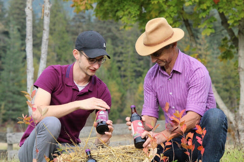 Jonas and Joerg Seidel from J&J Aronia with Aronia juice bottles