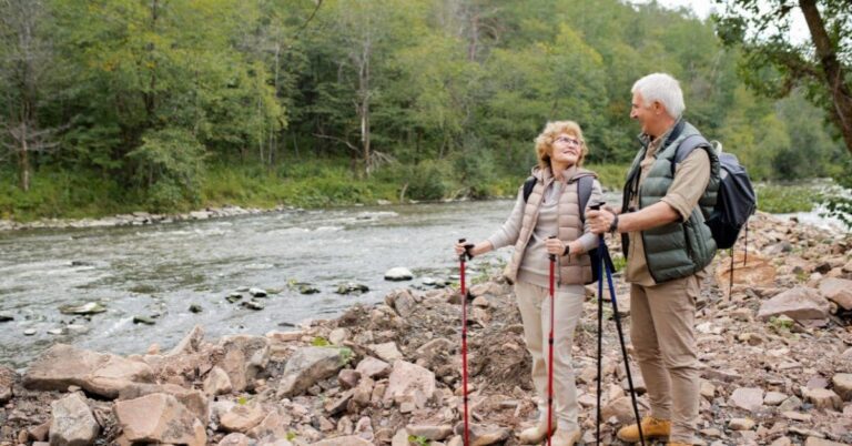 Elderly Couple hiking at river