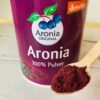 aronia original berry powder on spoon